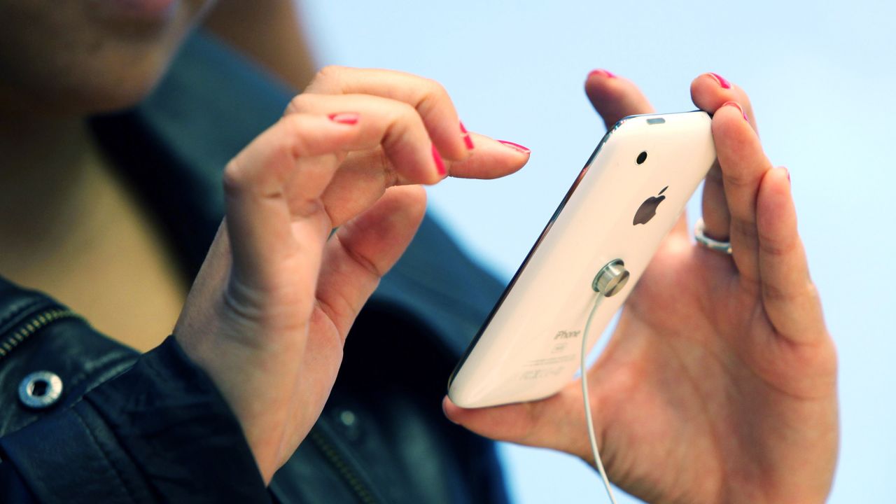 An Apple Store customer plays with the new iPhone 3Gs on June 19, 2009 in San Francisco, California.