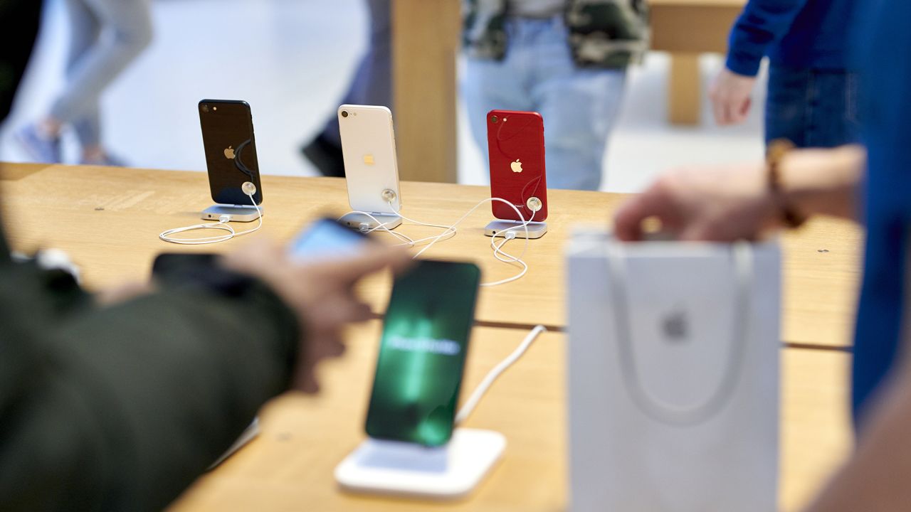 Apple iPhone SE 3 smartphones are seen during the sales launch at the company's flagship store in New York City on March 18, 2022.